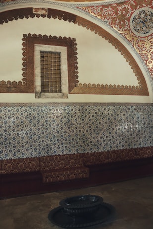 Elegant riad room featuring intricate tile work and a private balcony.