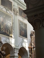 Historic museum interior with intricate architectural details and warm lighting.