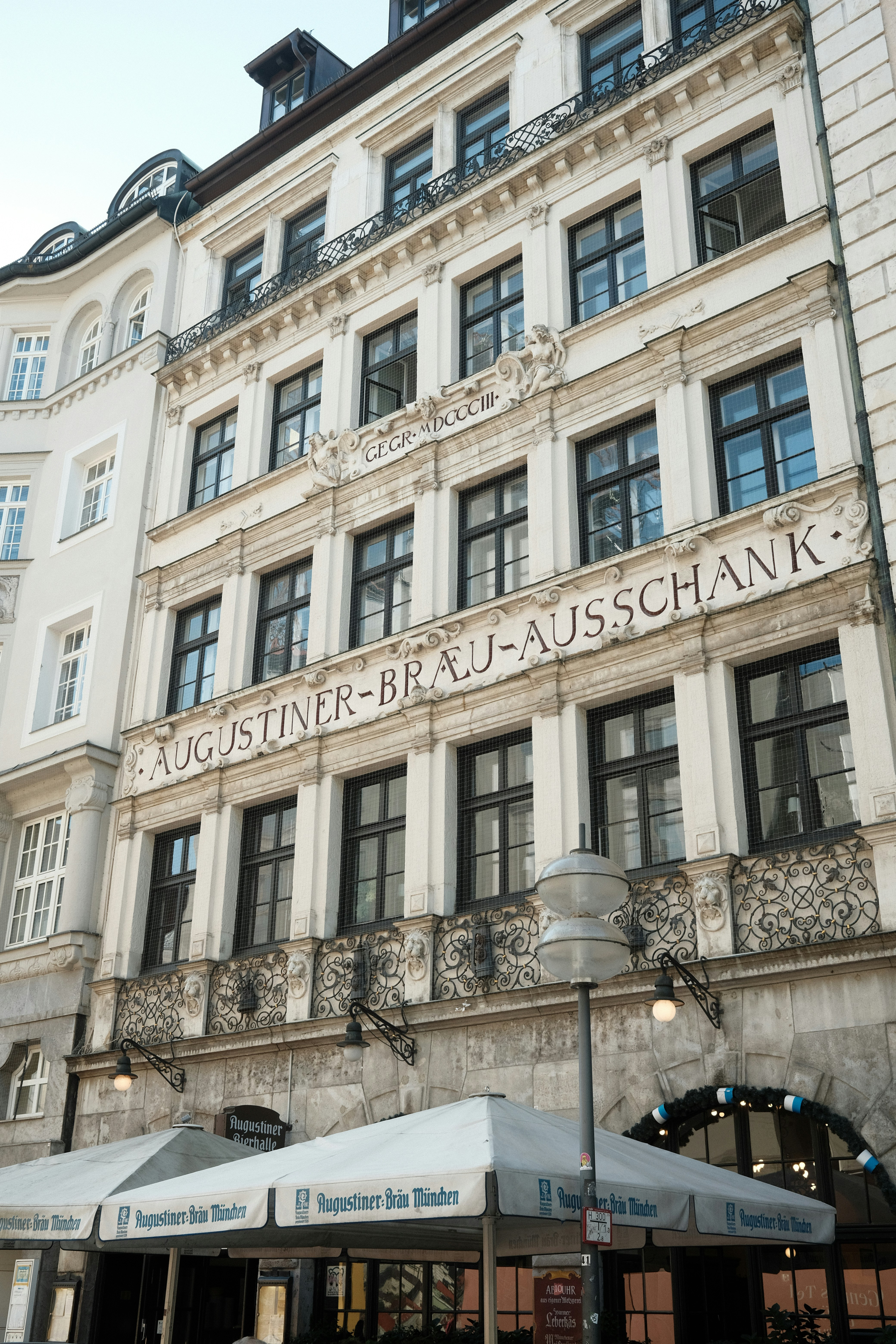 a tall building with a sign on the side of it