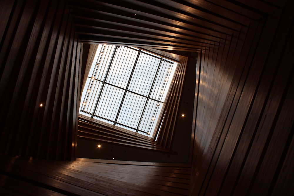 a room with a wooden floor and a window