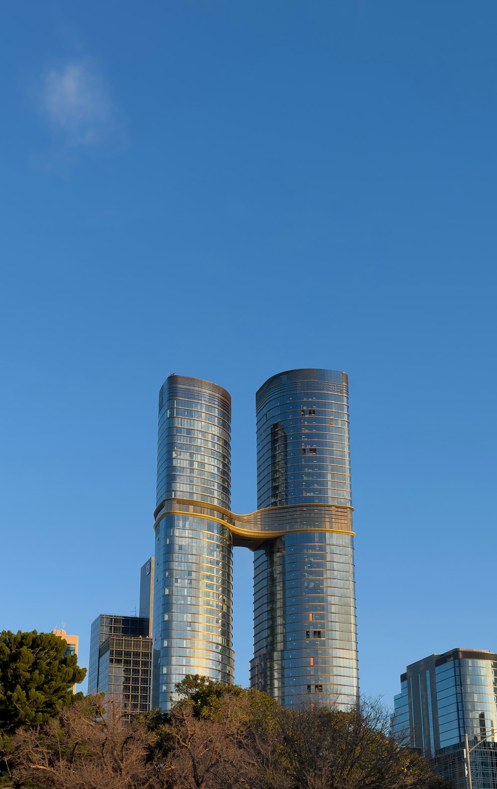 a couple of tall buildings sitting next to each other