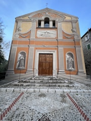 A well-maintained building façade with fresh paint and restored masonry elements.