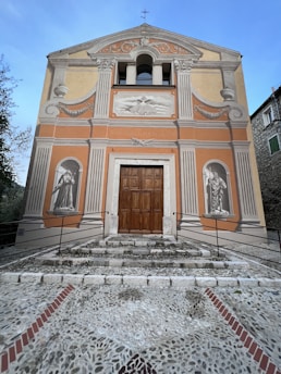 A well-maintained building façade with fresh paint and restored masonry elements.