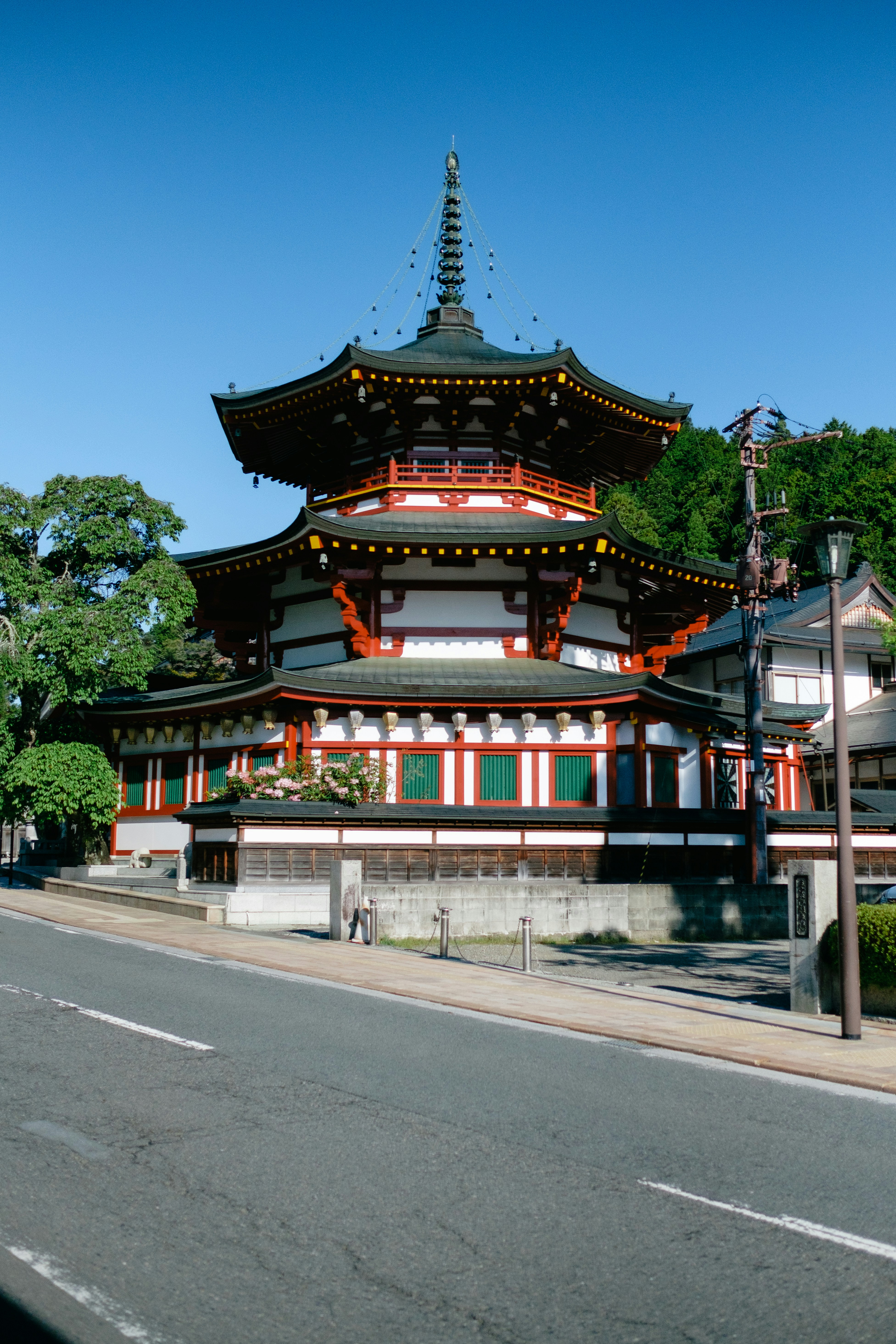a tall building sitting on the side of a road