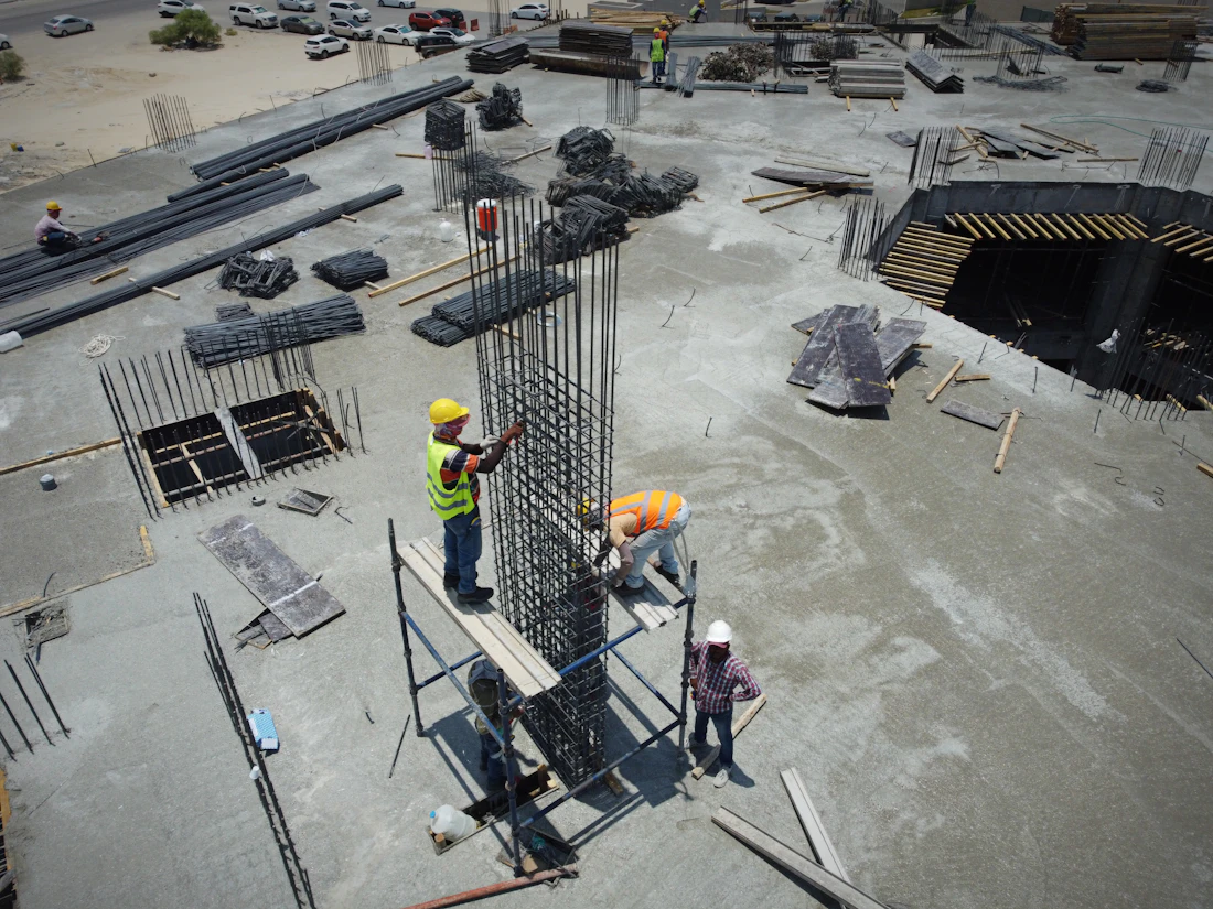 Construction site engineers reviewing project plans