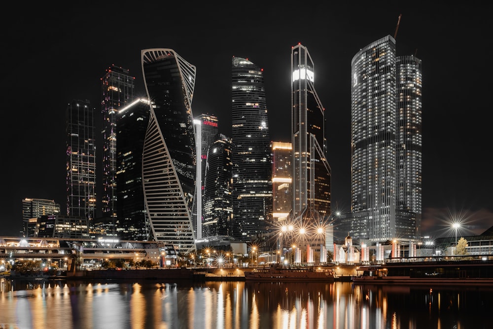 a night scene of a city with skyscrapers