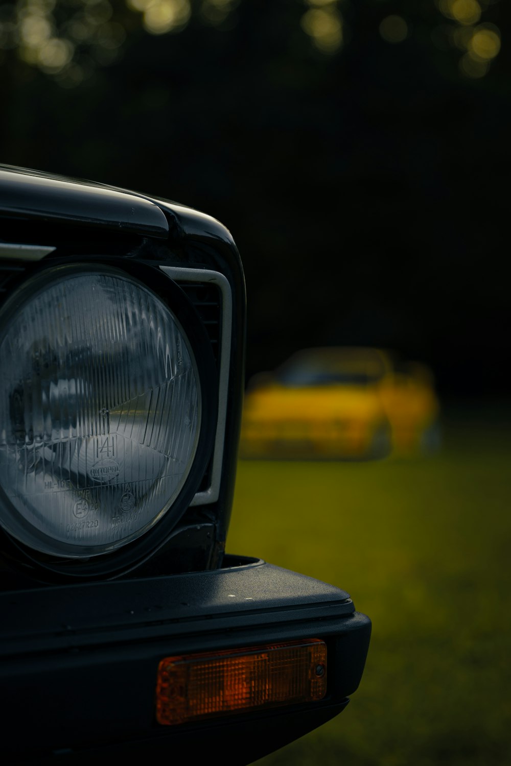 a close up of a headlight on a car