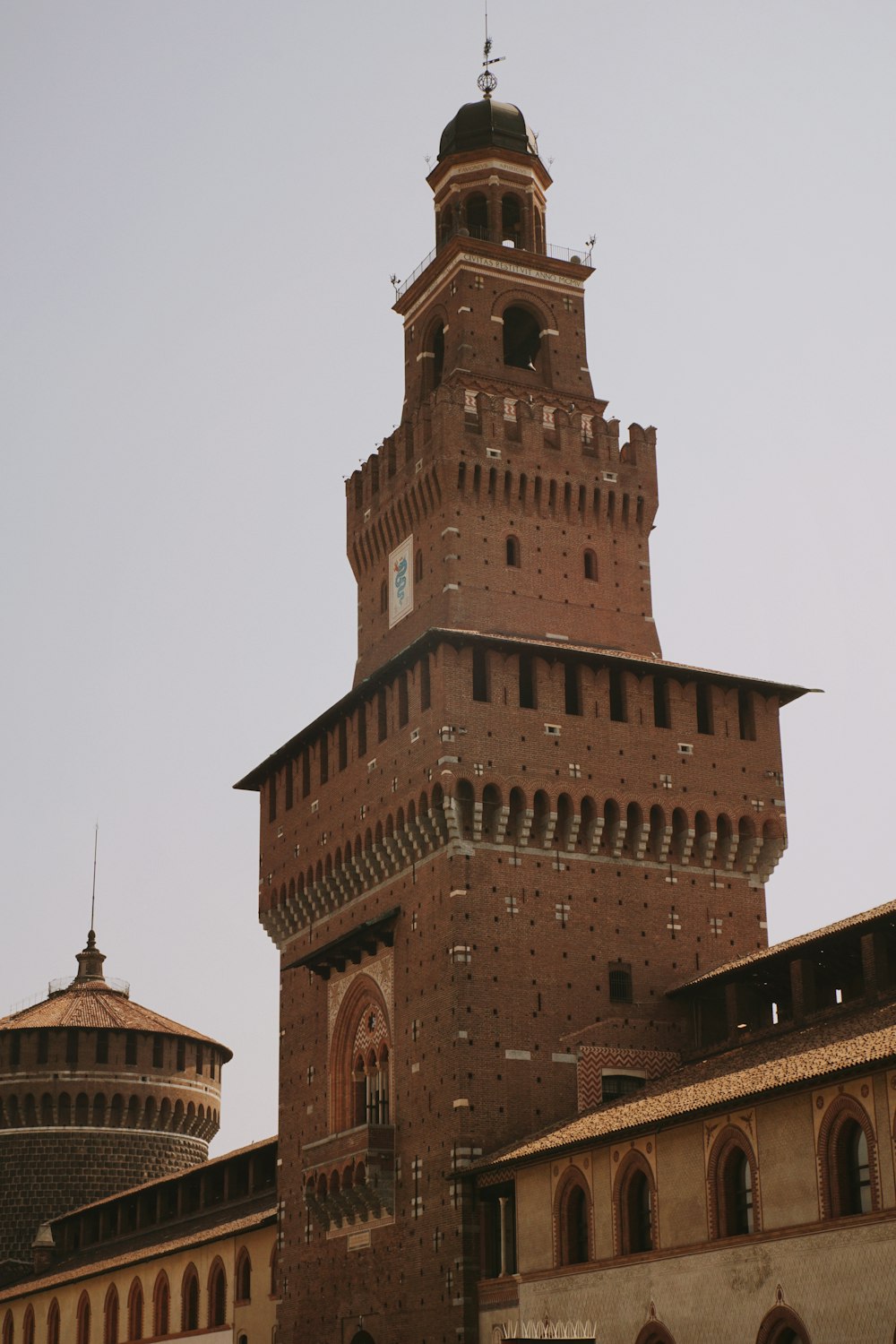 a very tall tower with a clock on it's side