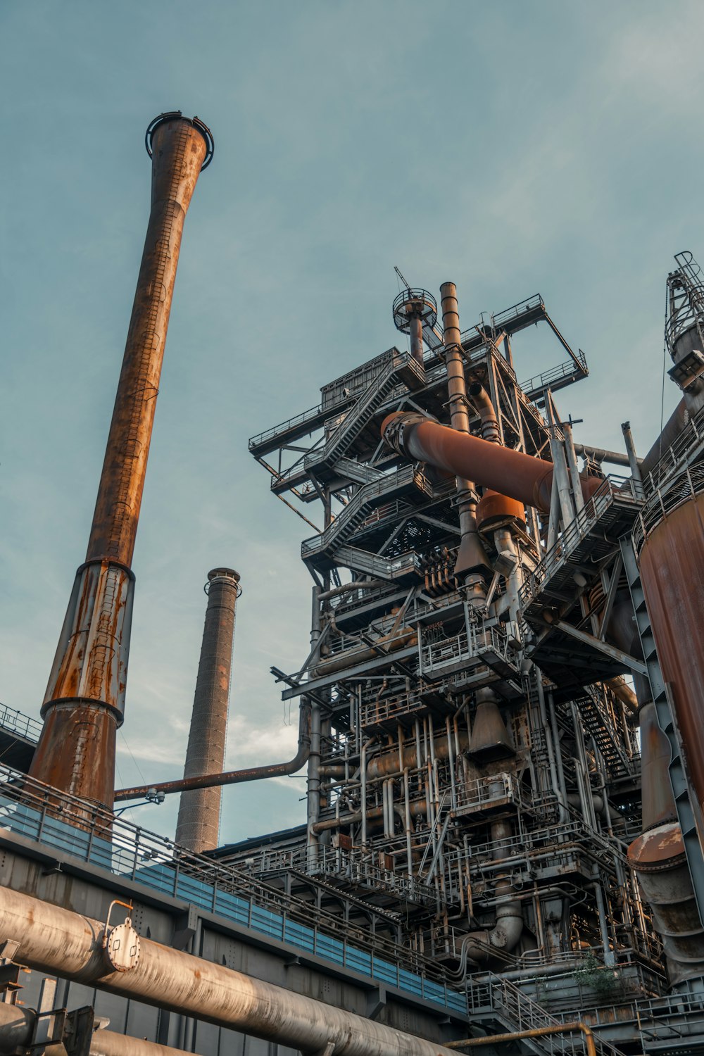 a large industrial building with a lot of pipes