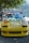 A vibrant car showcasing stunning stickers in a sunny environment.