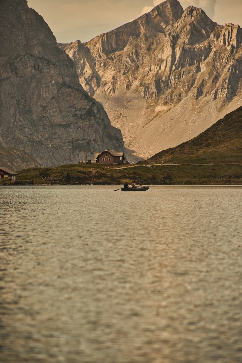 a couple of boats floating on top of a lake