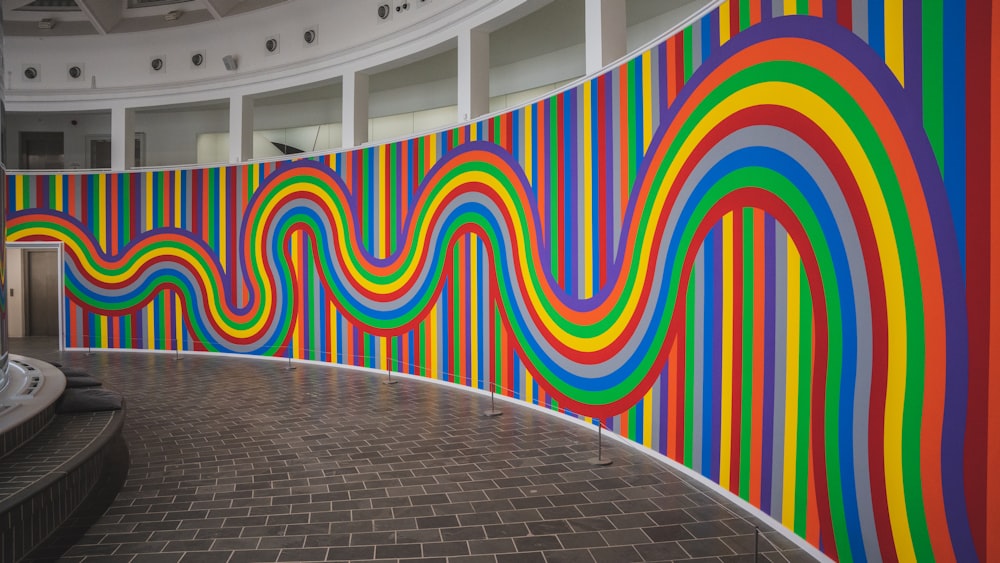 a large colorful wall in a large building
