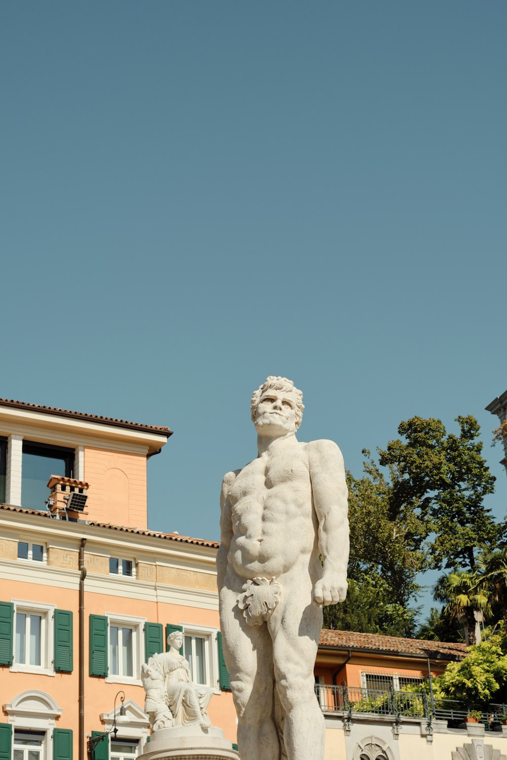 a statue of a man standing next to a fire hydrant