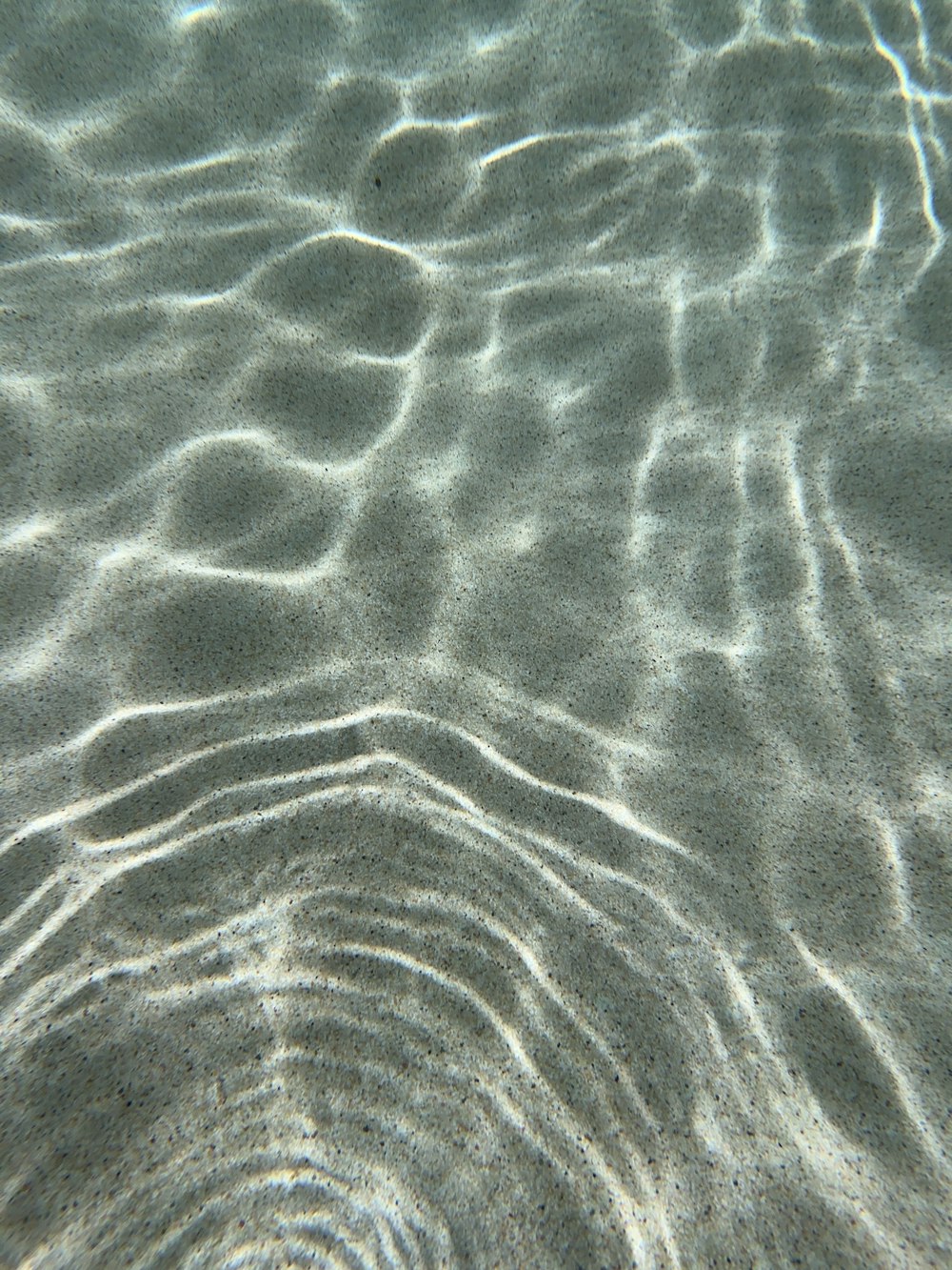 a close up view of the sand and water