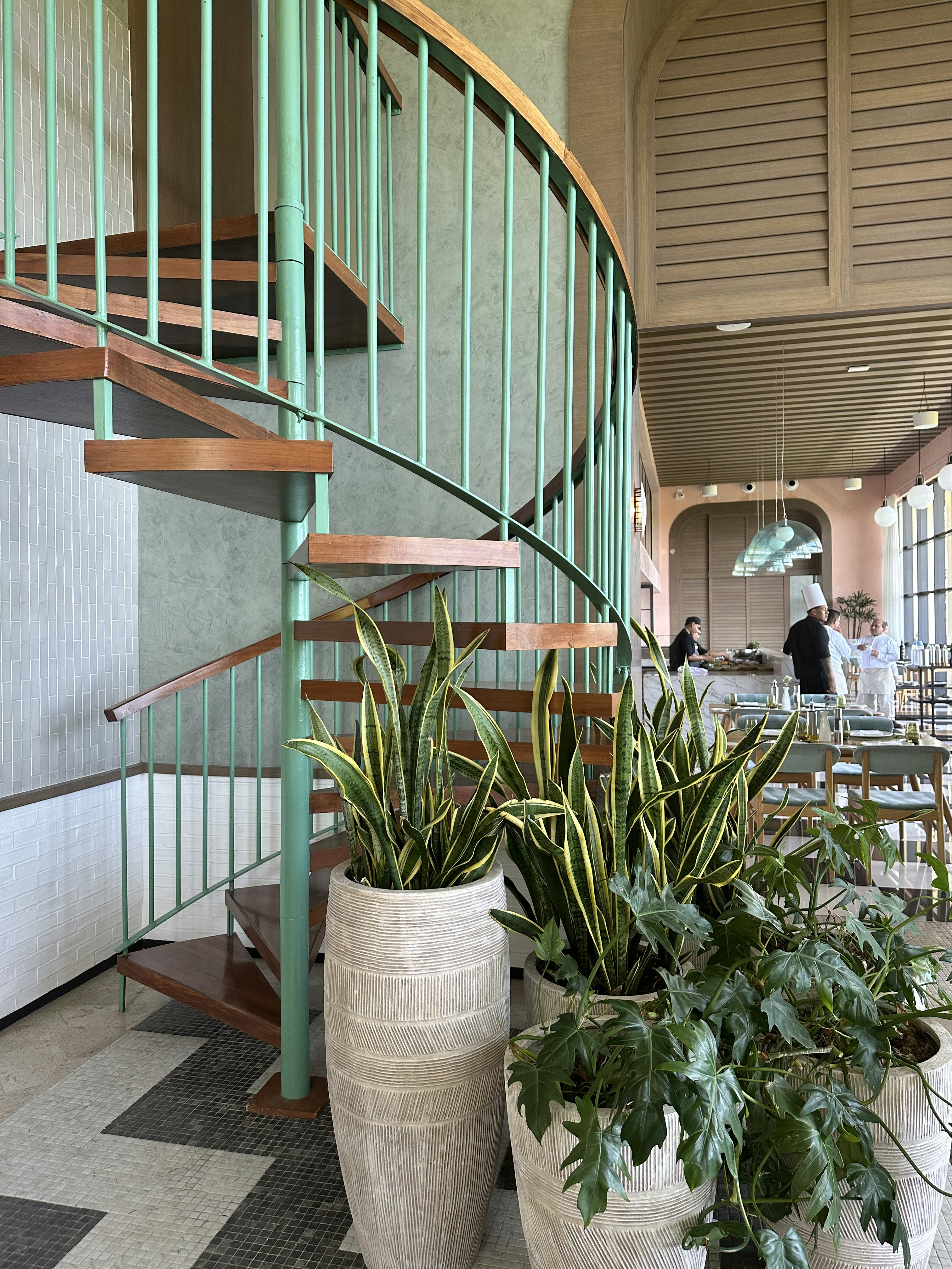 a couple of planters sitting on top of a checkered floor