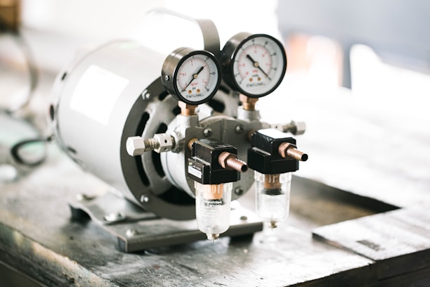 Close-up of a digital pressure gauge mounted on industrial equipment.