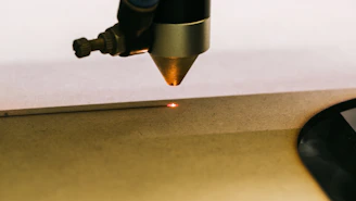 a close up of a metal object with a light on it