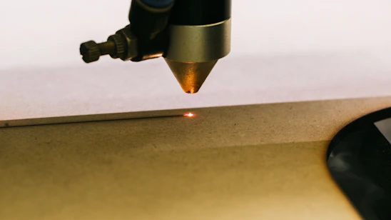 a close up of a metal object with a light on it