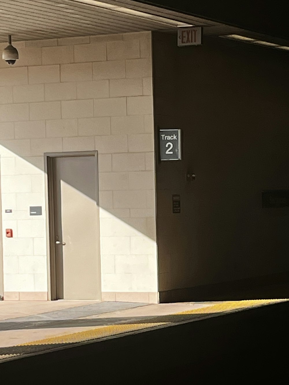 a building with two doors and a sign that says exit