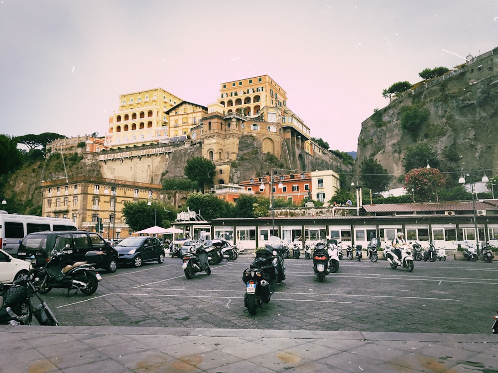 a group of motorcycles parked in a parking lot