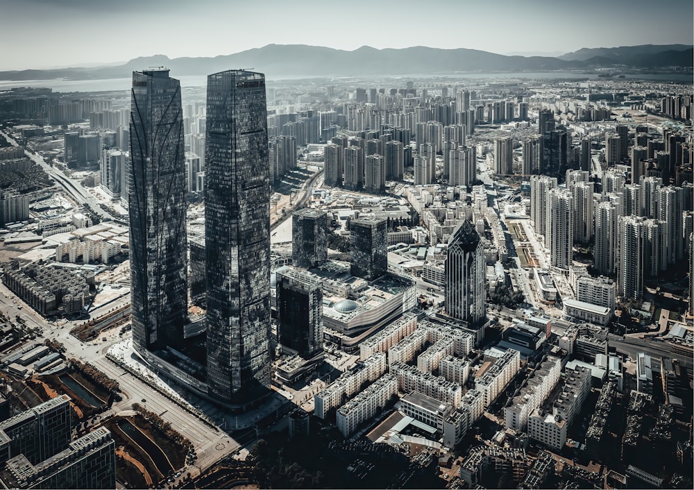 an aerial view of a city with tall buildings