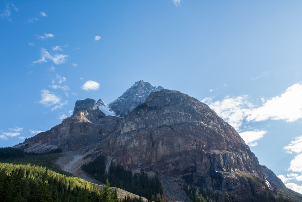 a very tall mountain with a sky background