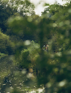 A serene outdoor retreat setting with participants reflecting quietly in nature.