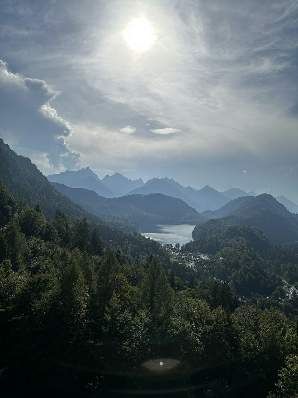 a scenic view of a lake surrounded by mountains