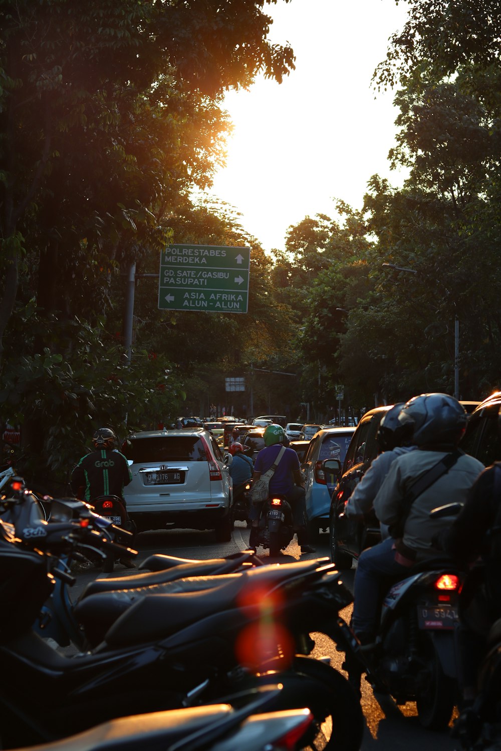 a group of motorcycles parked on the side of a road