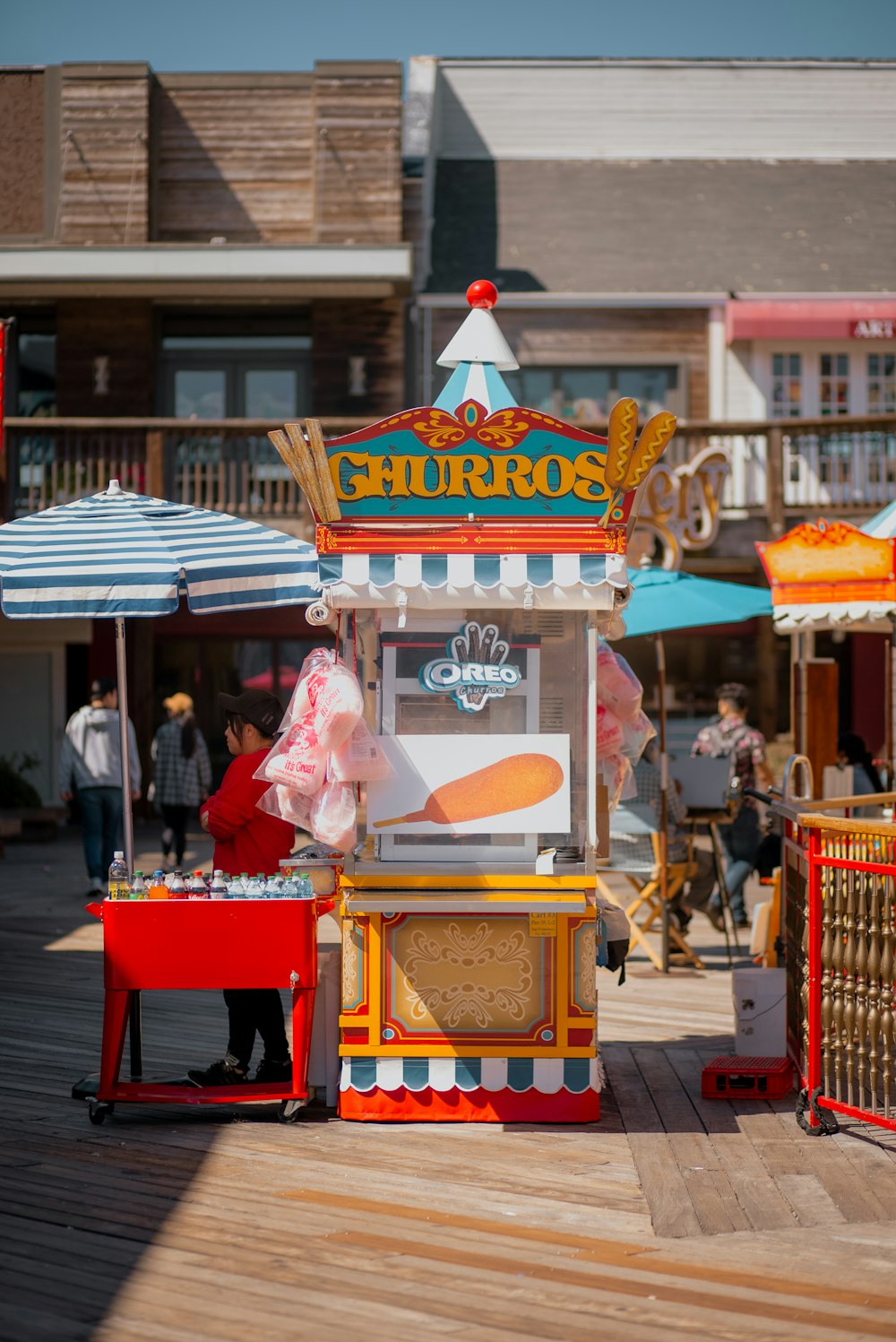 a small food stand on a wooden deck