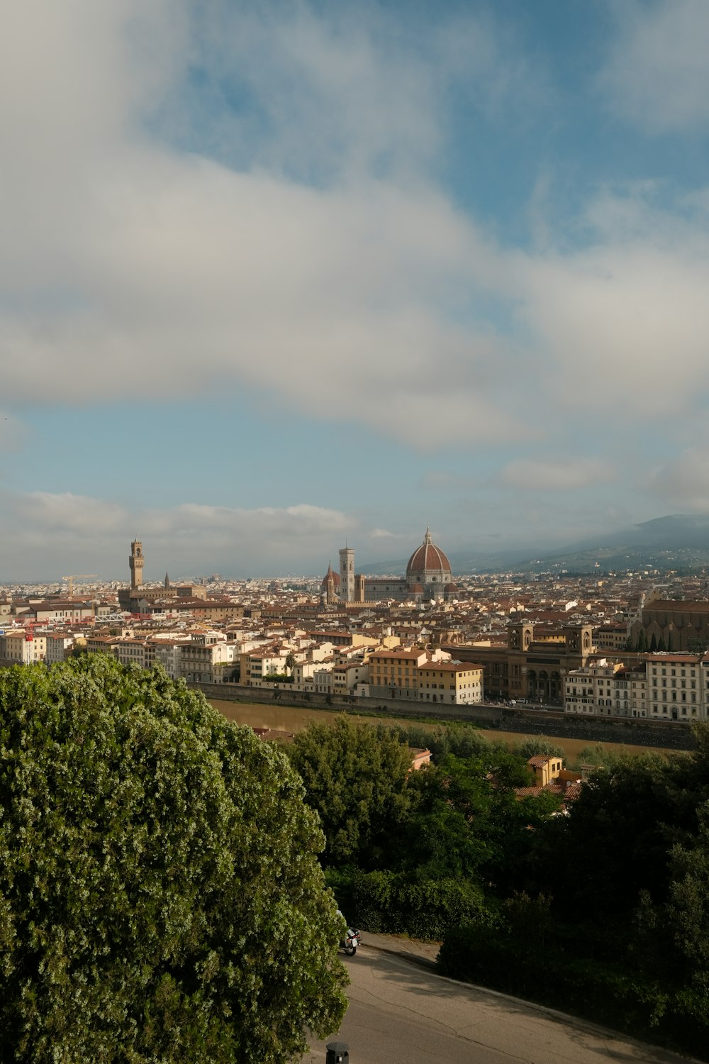 a view of a city from the top of a hill