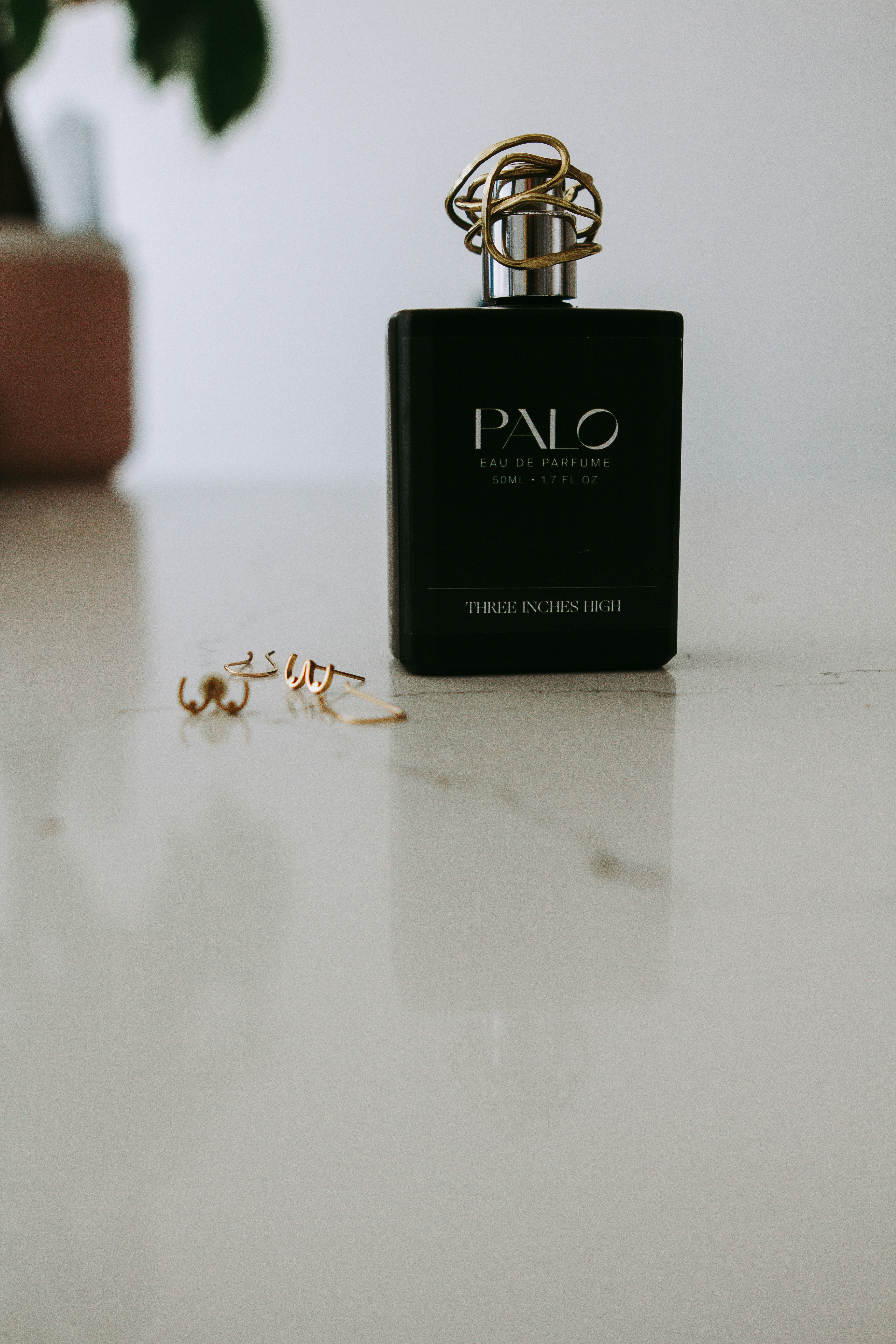 a bottle of perfume sitting on top of a table