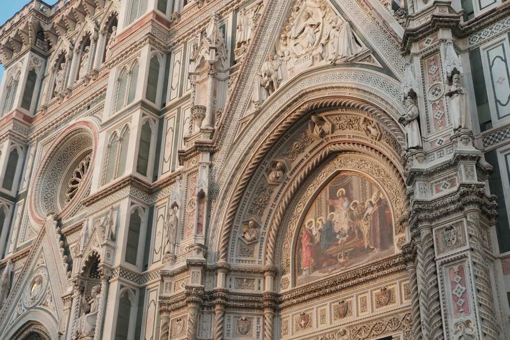 a large ornate building with a clock on it's side