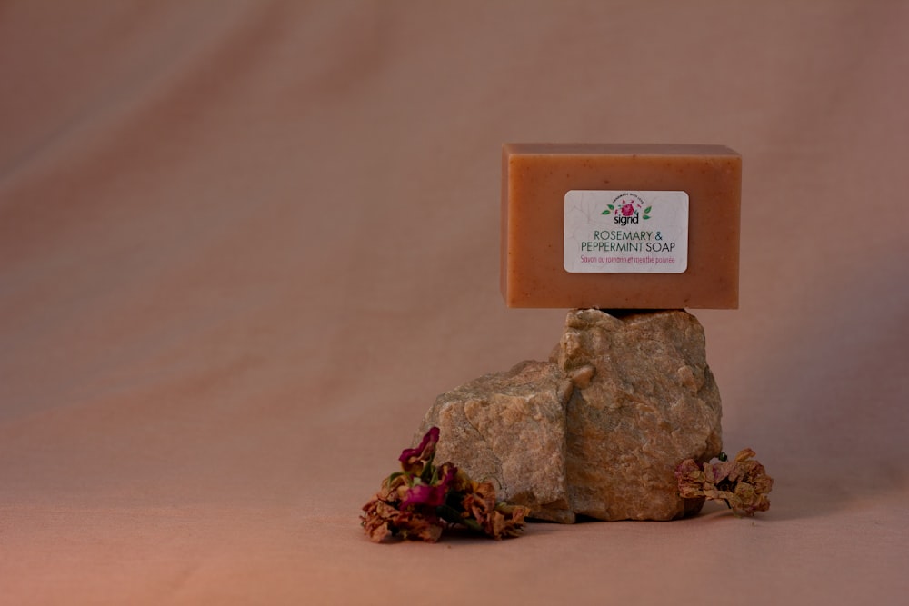 a bar of soap sitting on top of a rock