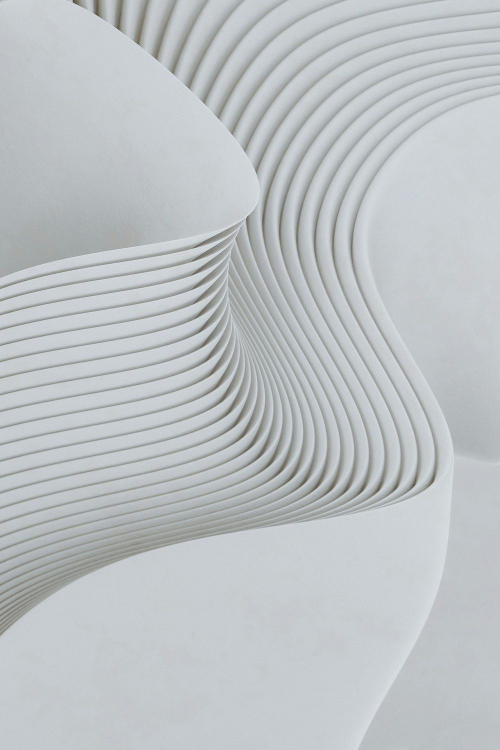 a close up of a white sculpture with wavy lines