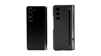 Two smartphones are displayed side by side. The left phone has a sleek, black design with three vertically aligned rear cameras. The right phone also features three cameras and has a case with a slot for a stylus, which is visible along the edge.