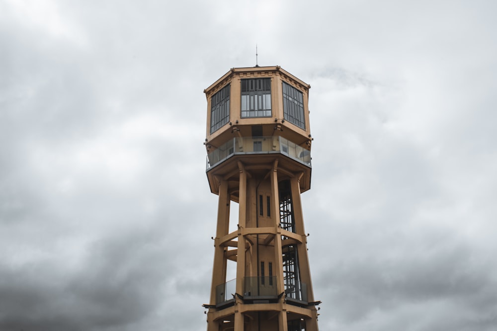 a tall tower with a clock on the top of it