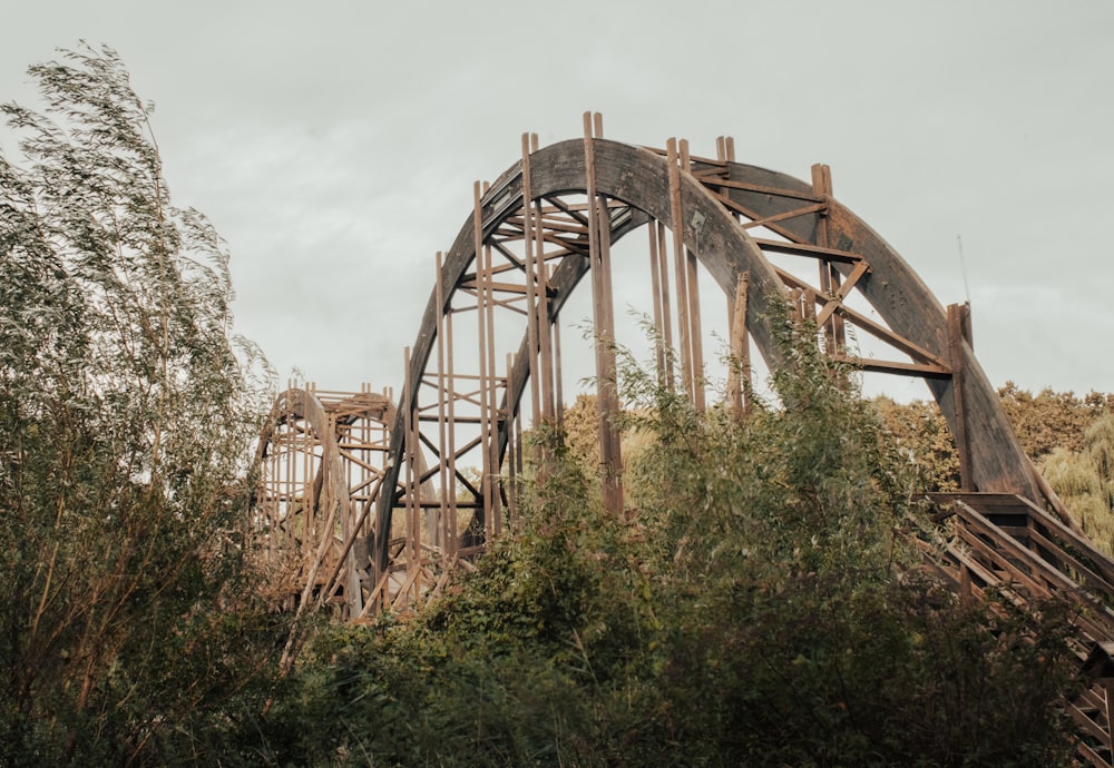 a very old bridge that is going over a hill