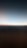 A gradient of colors fading from dark to light, with a blurry horizontal line separating two sections. The lower part is darker, while the upper part transitions into a lighter shade.