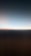 A gradient of colors fading from dark to light, with a blurry horizontal line separating two sections. The lower part is darker, while the upper part transitions into a lighter shade.