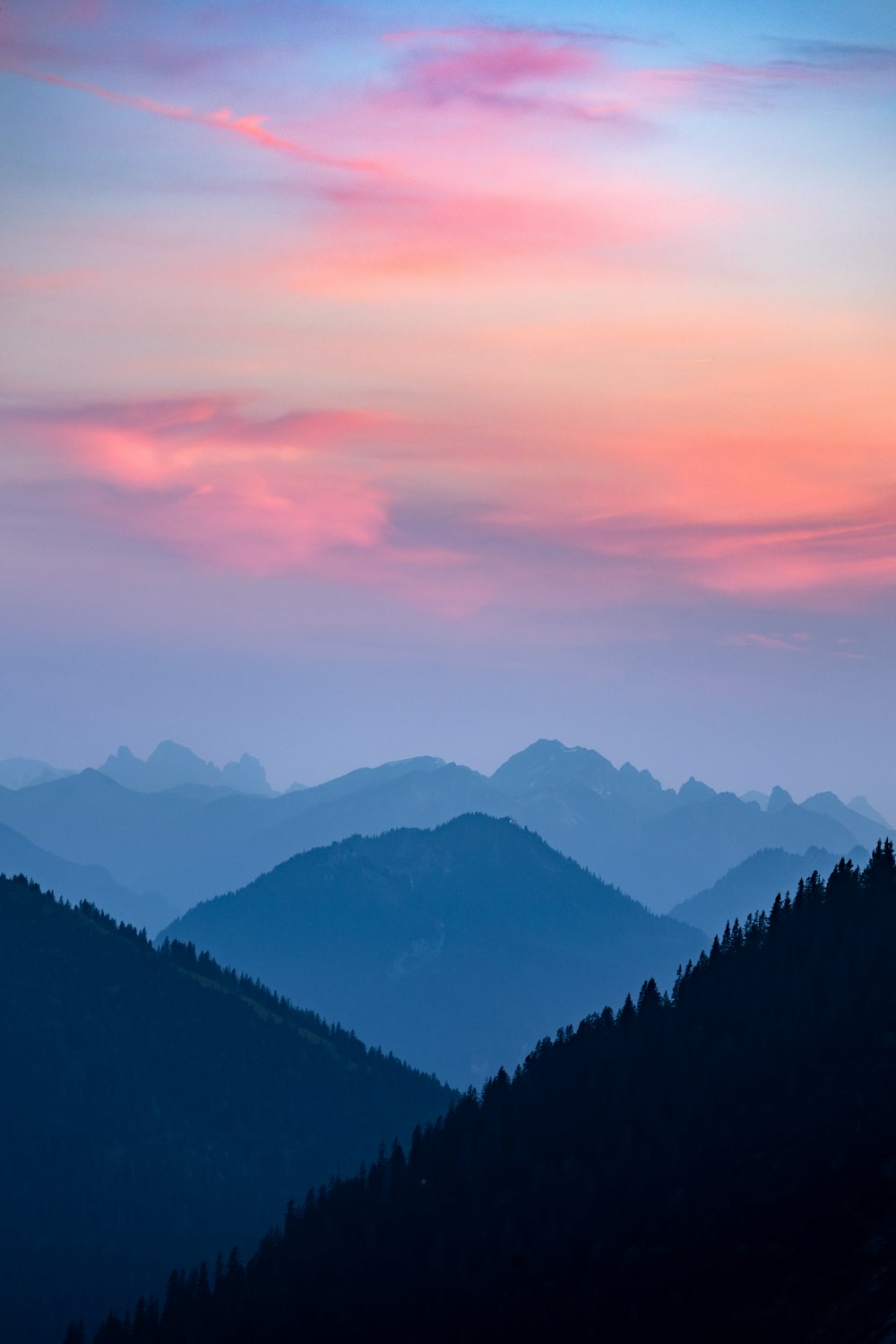 a view of a mountain range at sunset