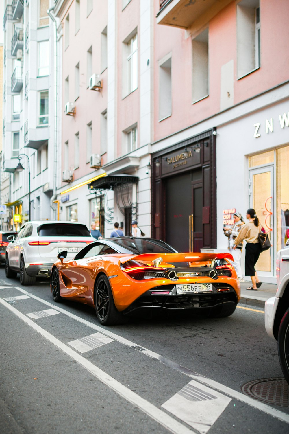 a group of cars parked on the side of a street