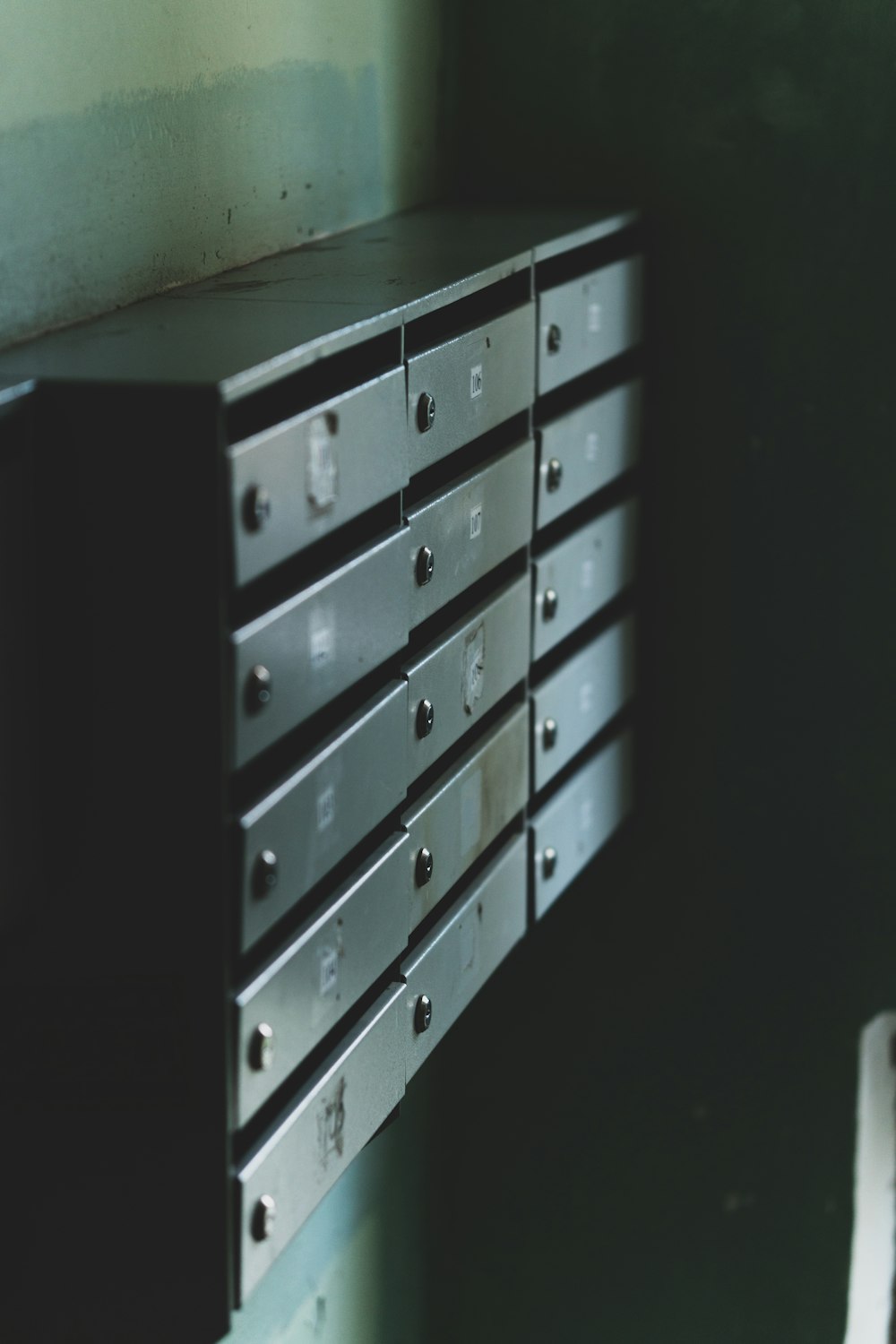 a close up of a metal drawer on a wall