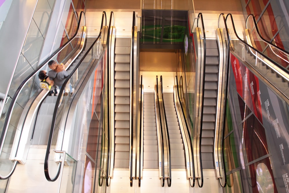 a man riding an escalator down a set of stairs