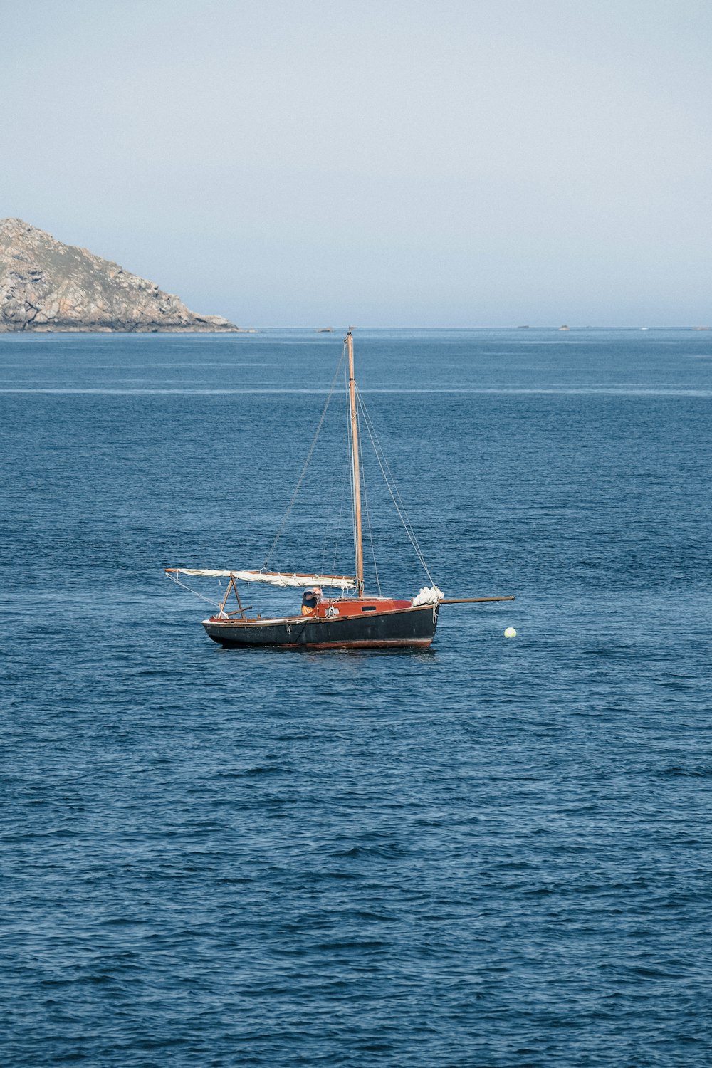 a sailboat in the middle of a large body of water