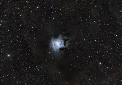 A glowing nebula with twinkling stars highlighting an interactive link area.