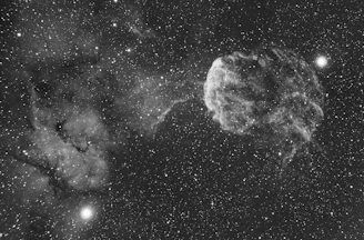 Close-up of a golden foil star map highlighting intricate celestial details on a dark background.