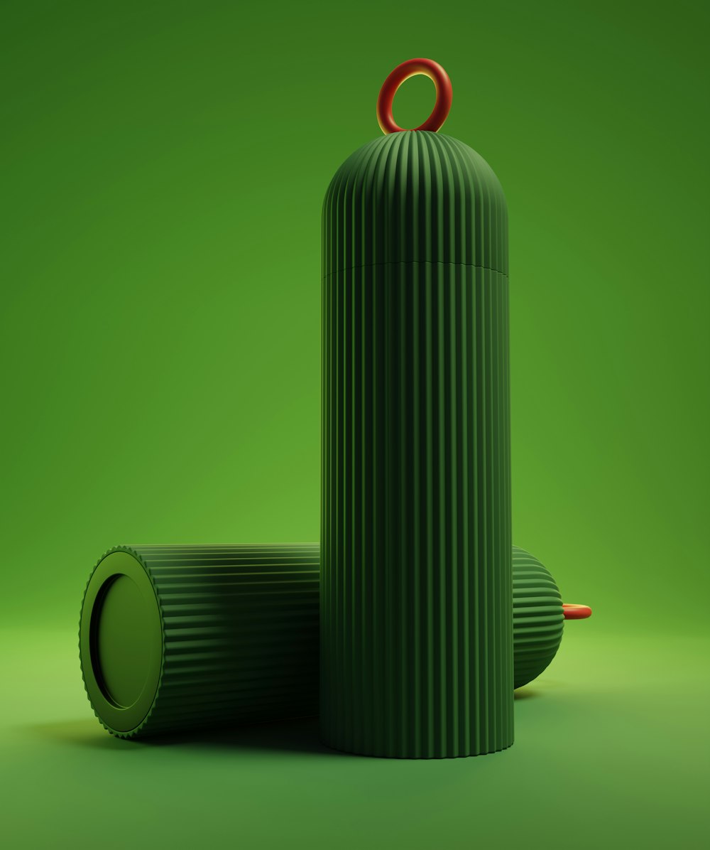 a green object with a red ring on top of it
