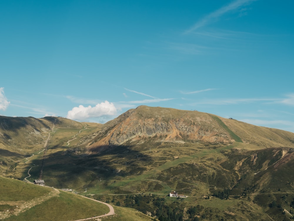 a view of a mountain with a road going through it