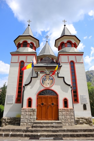 The stone-carved facade of the Trei Ierarhi Church in Iași.